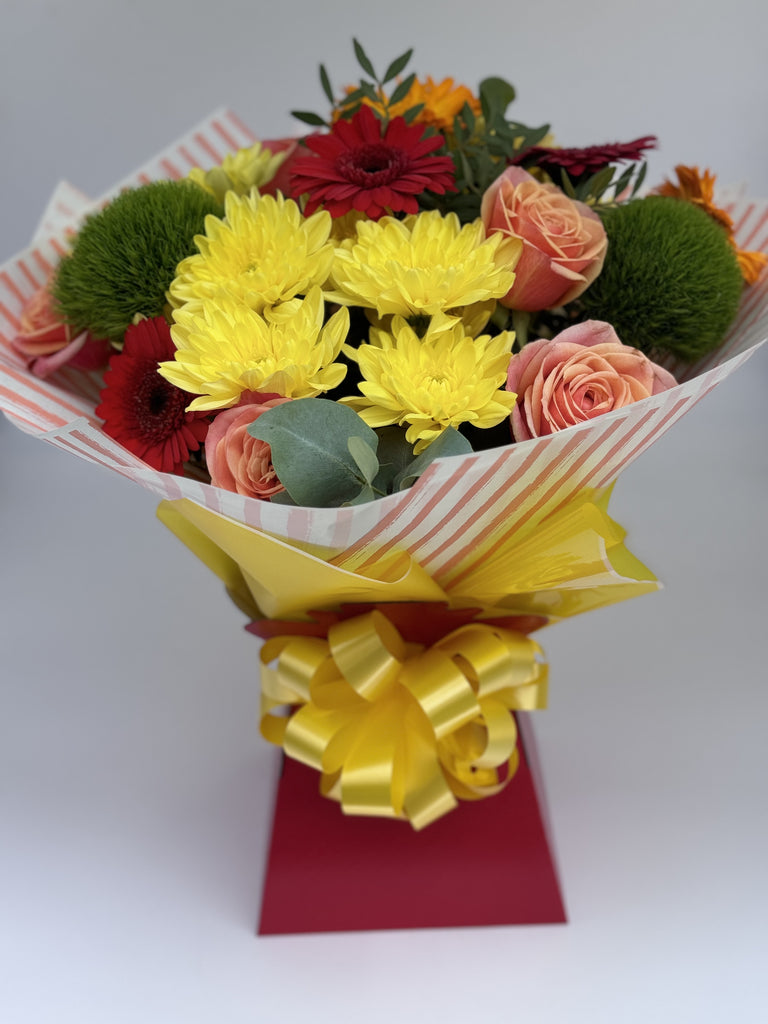 Vibrant hand tied - Rams florists