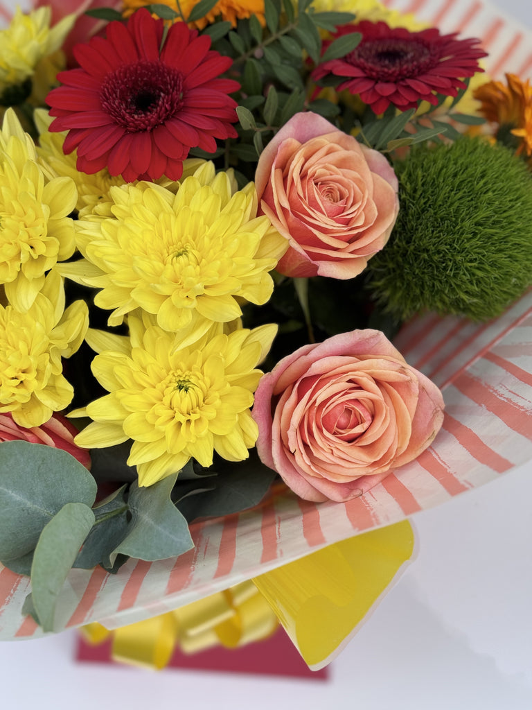 Vibrant hand tied - Rams florists