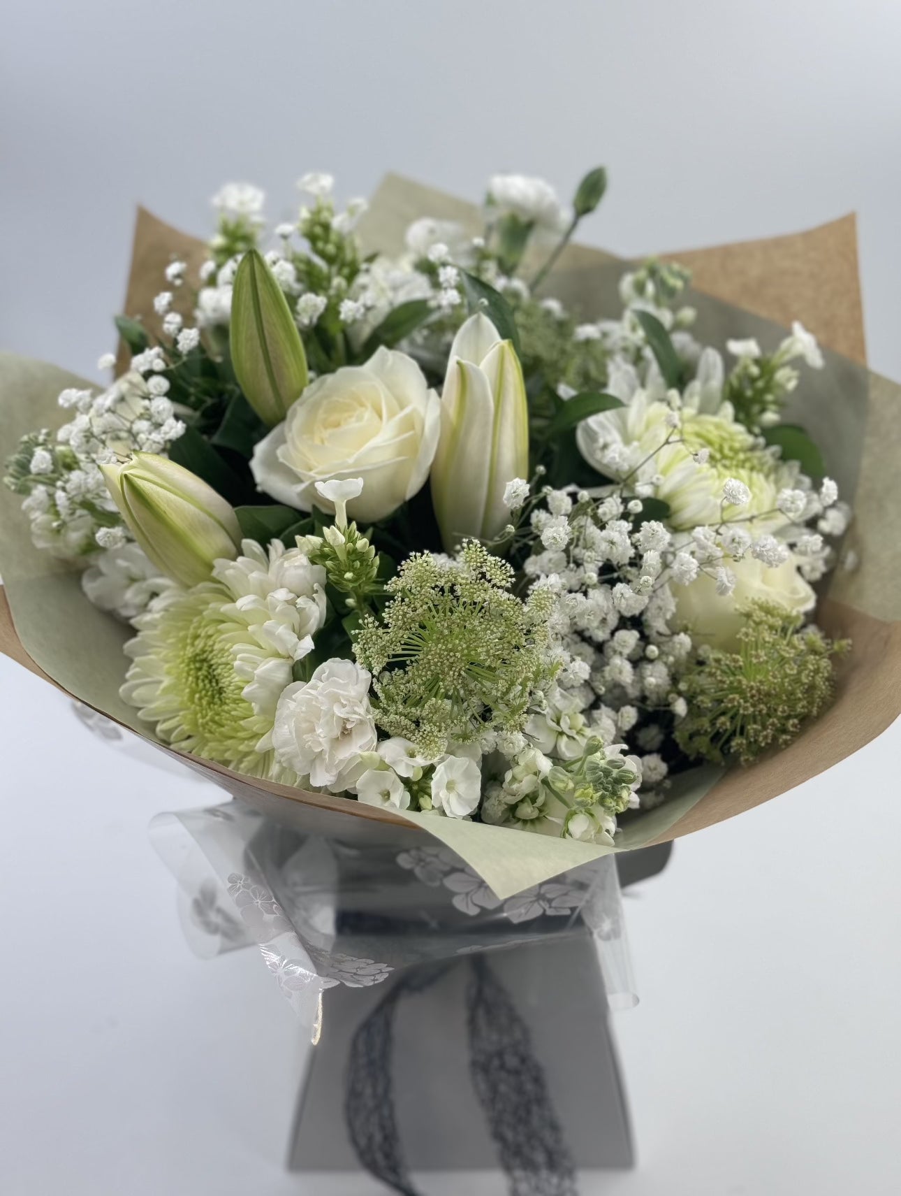 Sympathy hand tied made with the finest flowers - Rams florists