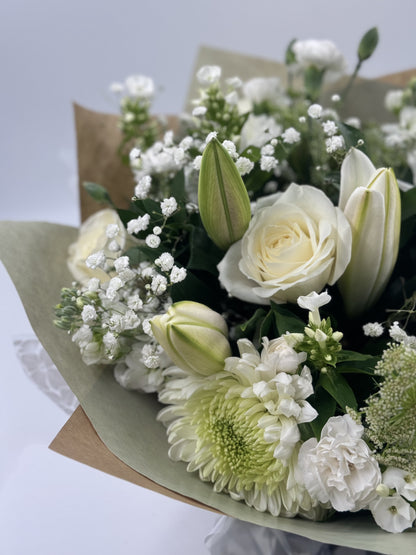 Sympathy hand tied made with the finest flowers - Rams florists