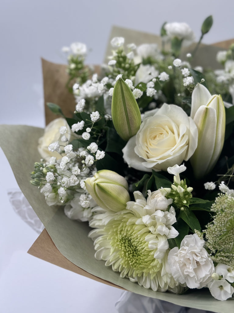 Sympathy hand tied made with the finest flowers - Rams florists