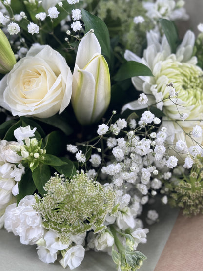 Sympathy hand tied made with the finest flowers - Rams florists