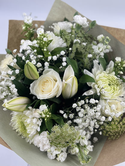 Sympathy hand tied made with the finest flowers - Rams florists