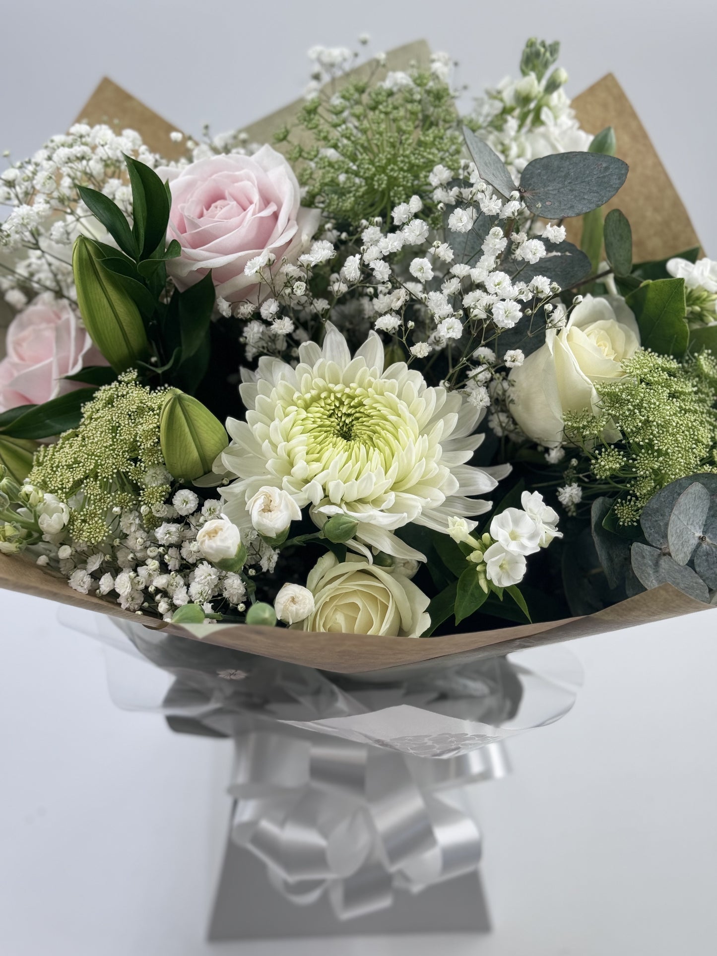 Sympathy hand tied made with the finest flowers - Rams florists