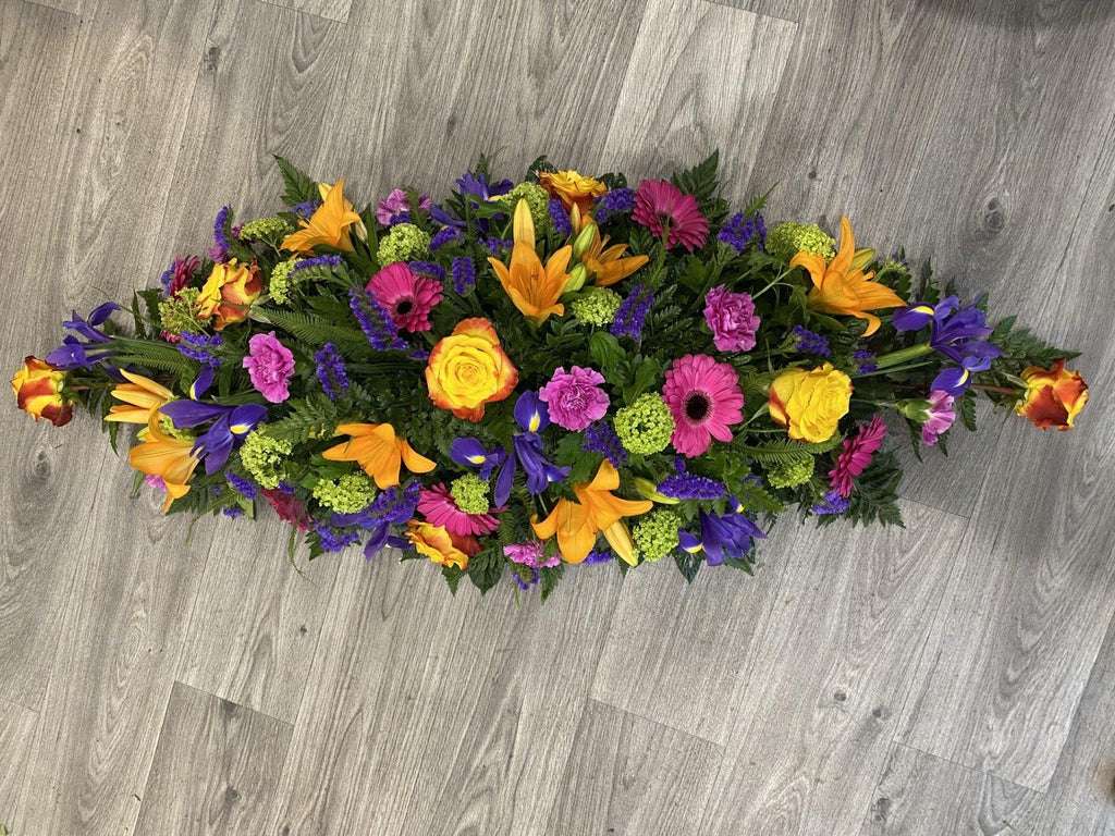 Vibrant Casket Spray - Rams florists