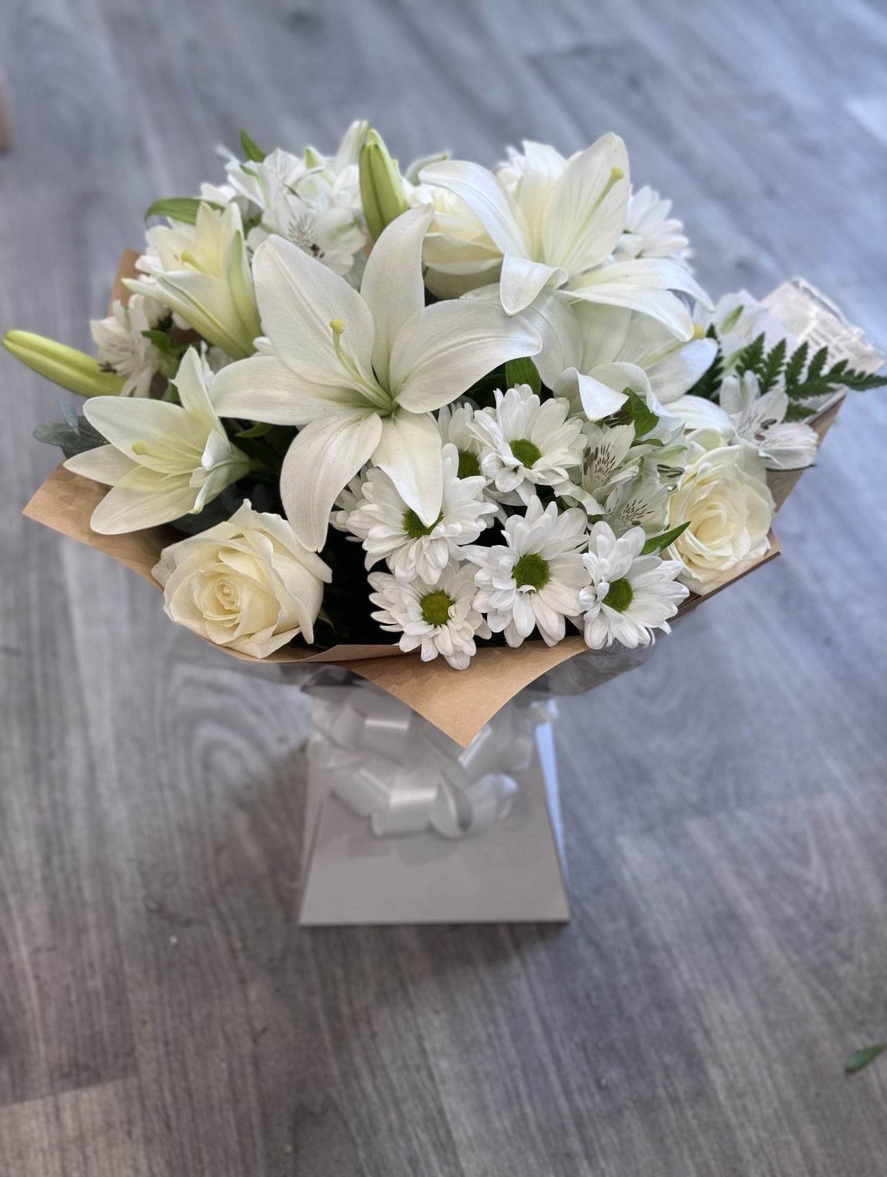 Sympathy hand tied made with the finest flowers.