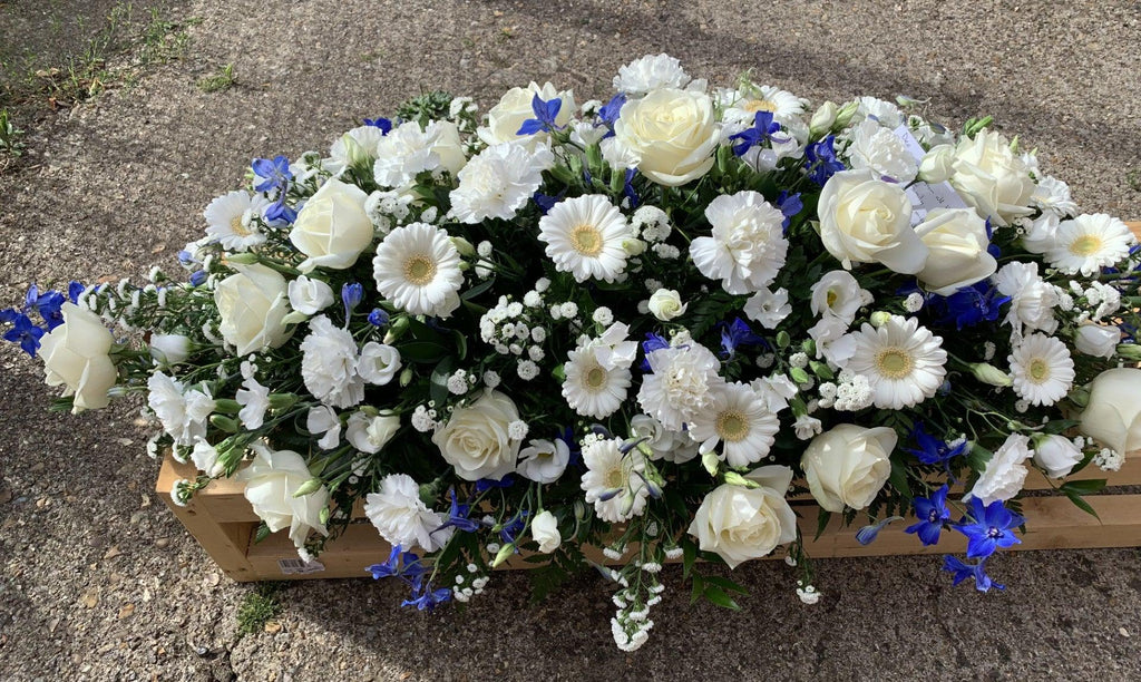 Blue and white Rose Casket Spray - Rams florists