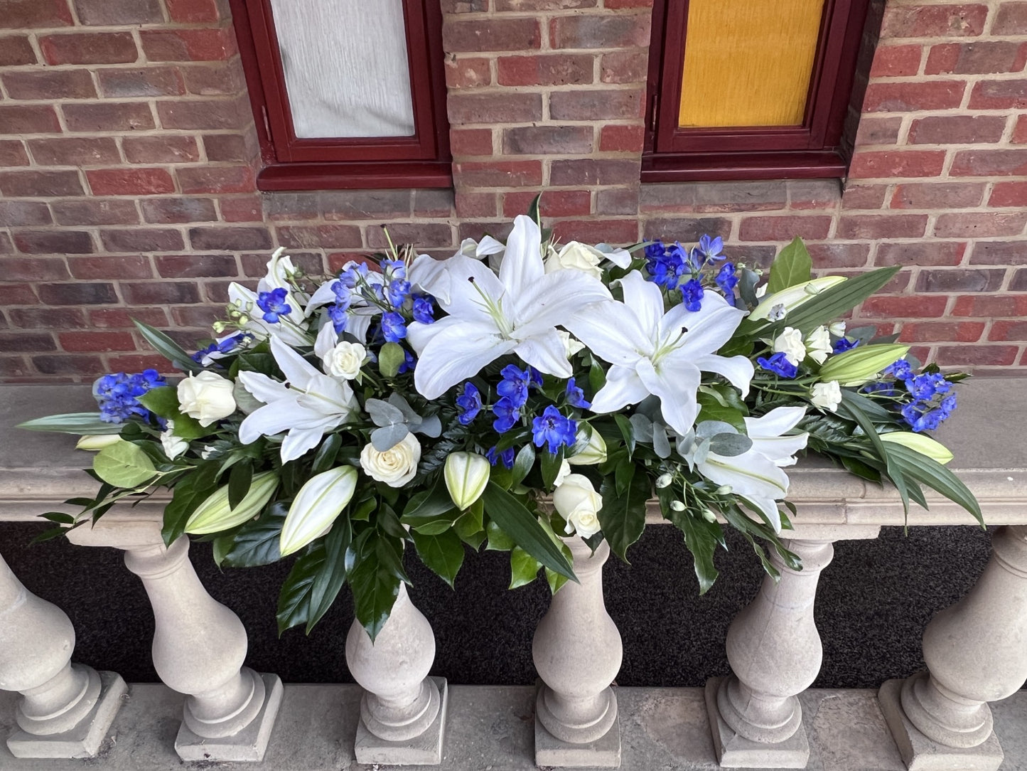 Blue and white Lily  Casket Spray